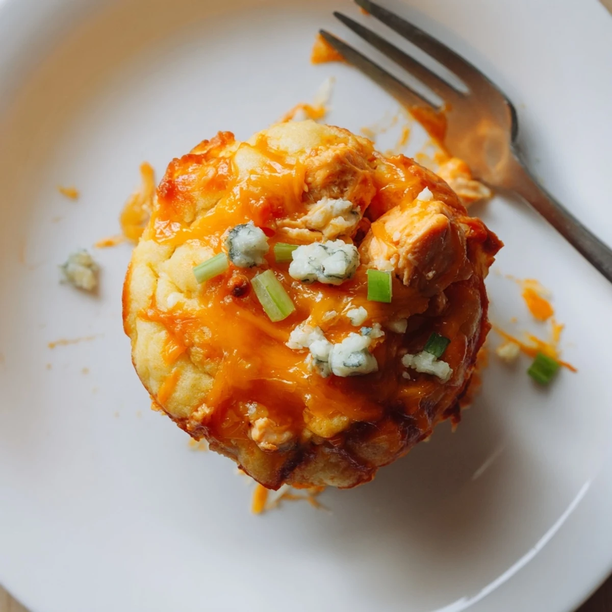 Spicy Buffalo Chicken Cheddar Drop Muffins fresh from the oven, golden and cheesy.  
