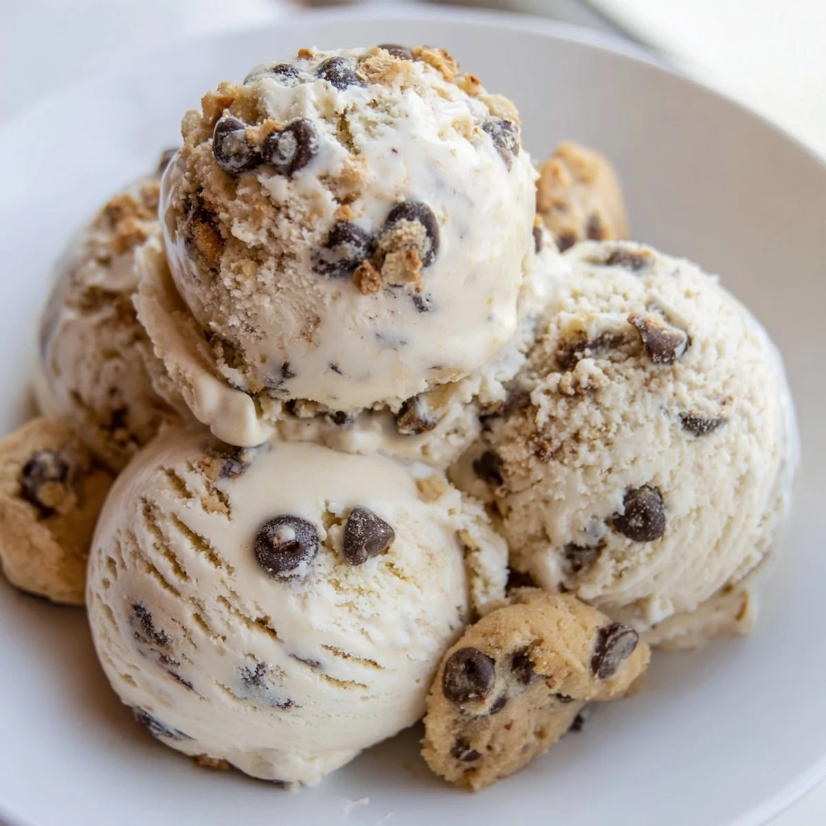 Indulge in homemade Cottage Cheese Ice Cream featuring chunks of edible cookie dough.