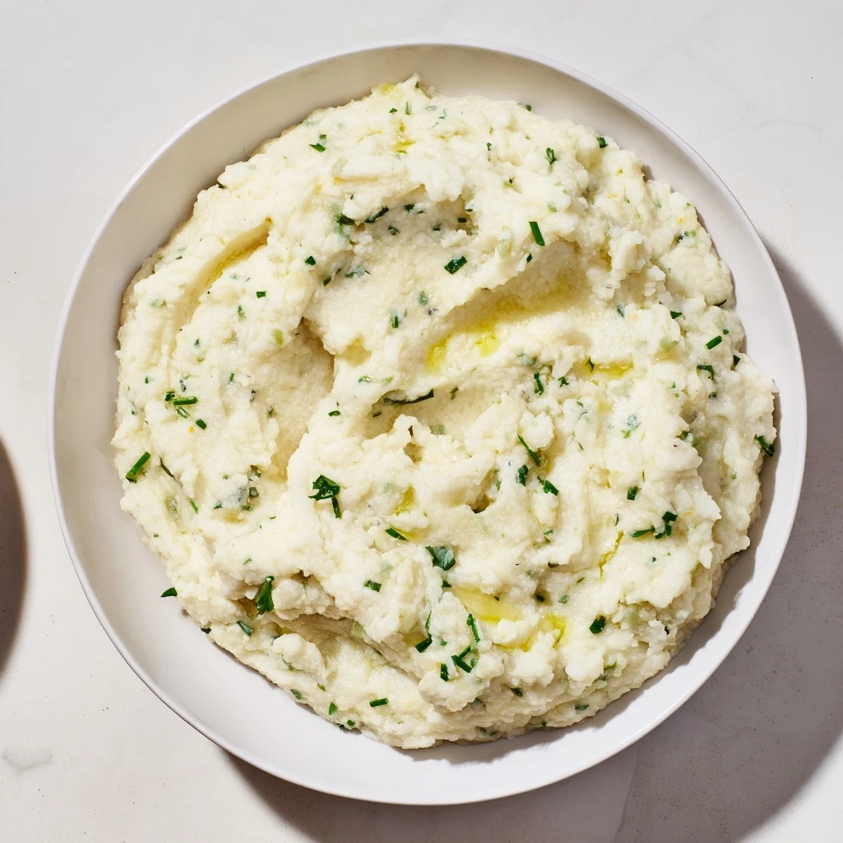 Fluffy and bright, this cauliflower mash recipe combines fresh herbs and lemon for flavor contrast.