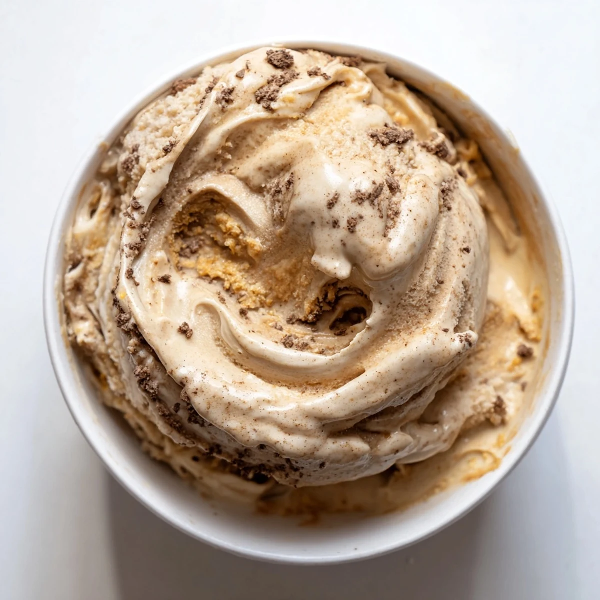Thick and decadent peanut butter banana ice cream in a bowl, perfect for a vegan dessert.