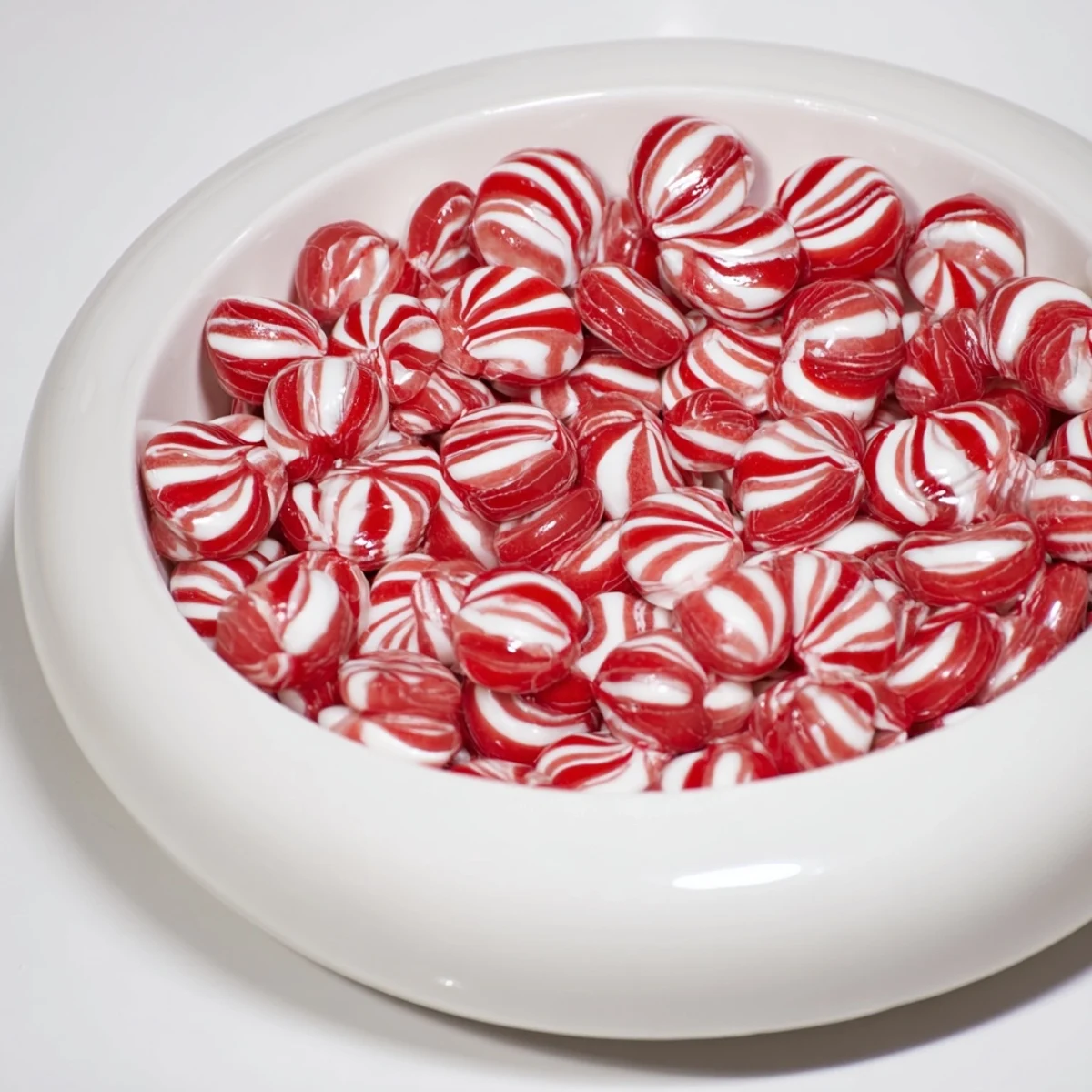 Melted peppermint candies forming a vibrant No-Bake Peppermint Candy Bowl, ideal for holiday treats.