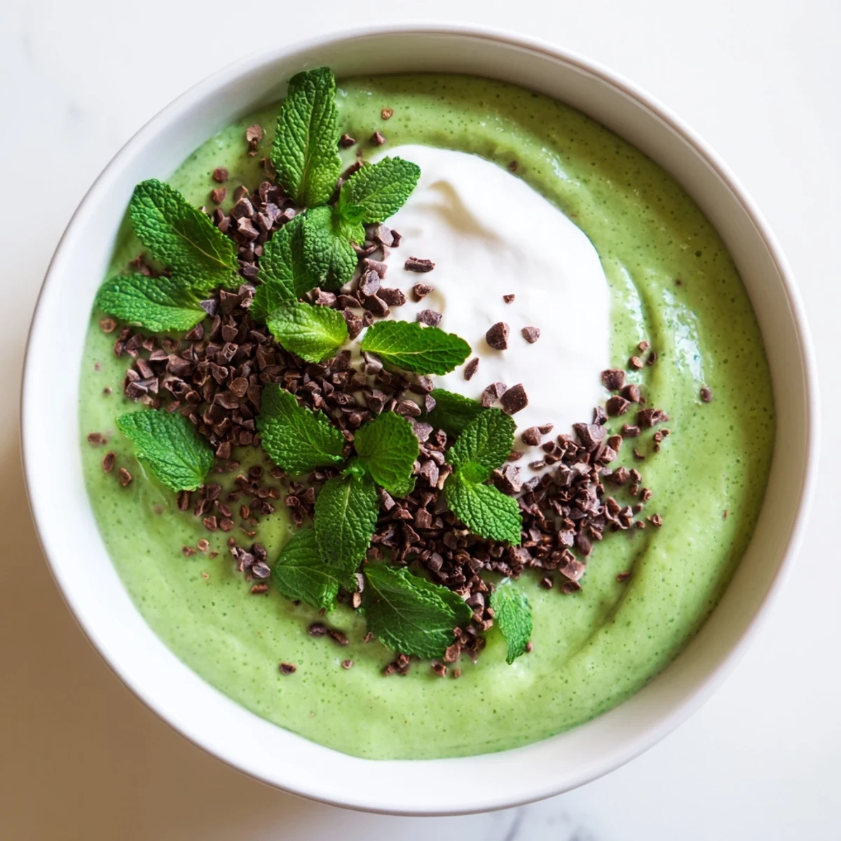 Vibrantly green Grinch Green Mint Matcha Breakfast Chia Pudding, chilled overnight for a refreshing vegan treat.