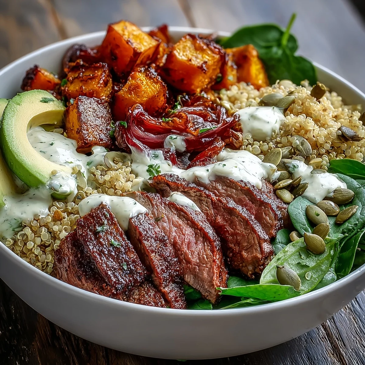 Fusion dinner bowl featuring tender steak, sweet roasted squash, and fresh avocado with zesty lime dressing ready to serve.
