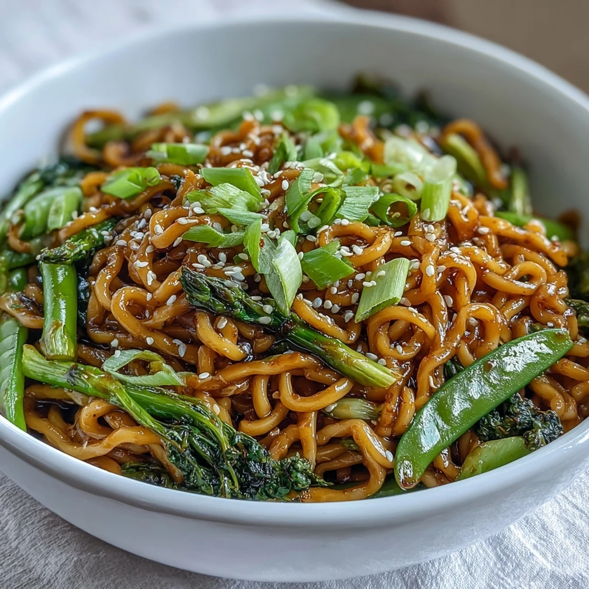 Fresh ginger and scallions infuse these Asian noodles, topped with crisp greens for a balanced vegetarian meal.