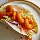 Close-up of spicy Buffalo Shrimp Wraps, showcasing juicy shrimp and colorful, fresh fillings.
