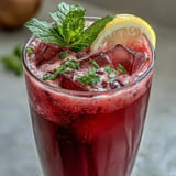 Garnish this beautiful beet-colored pink lemonade with fresh mint and lemon slices.