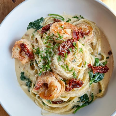 Tuscan Garlic Shrimp Pasta with tender shrimp and creamy sauce, perfect for a delightful dinner.