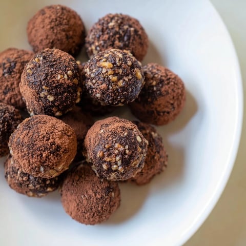Date & Walnut Truffles, rolled in cocoa, offer a decadent yet healthier dessert experience.