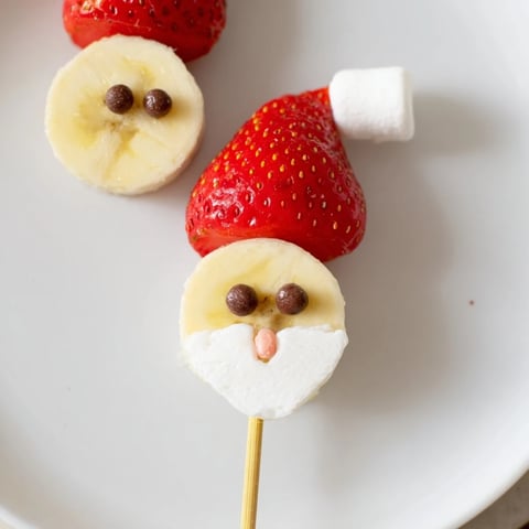 Banana Strawberry Santa Skewers, a cheerful festive snack, ready for holiday parties and easy treats.
