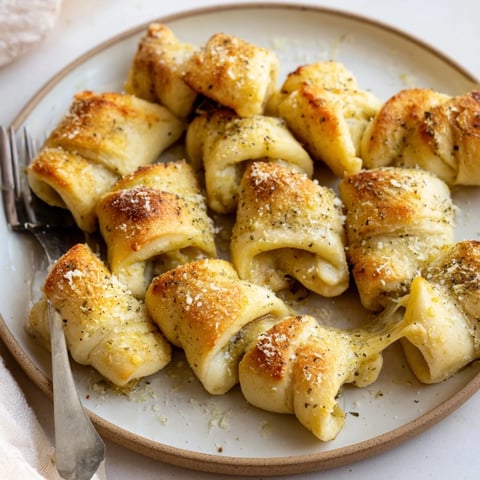 Golden, cheesy Savory Rolls: Crescent Roll Baked Cheese Bites, warm from the oven, ready to enjoy.