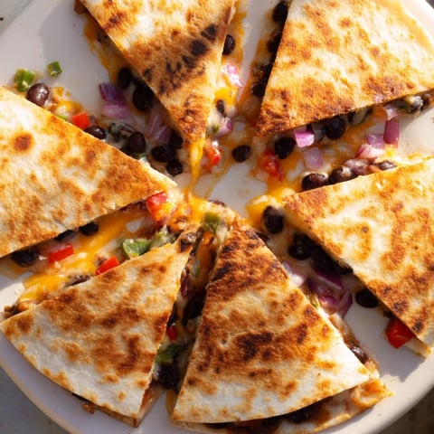 Golden, cheesy Black Bean Quesadilla, filled with flavorful beans and veggies, ready to enjoy.