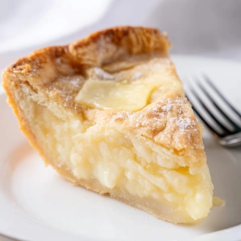 Delightful water pie showcases a golden crust, creamy filling, and vanilla aroma.  