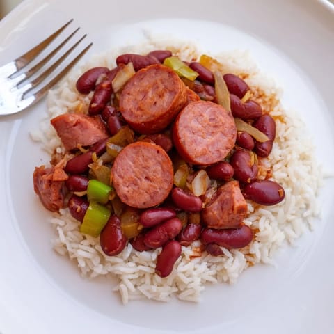 Hearty Red Beans & Rice with sausage, vegetables, and rice, a comforting Southern meal.