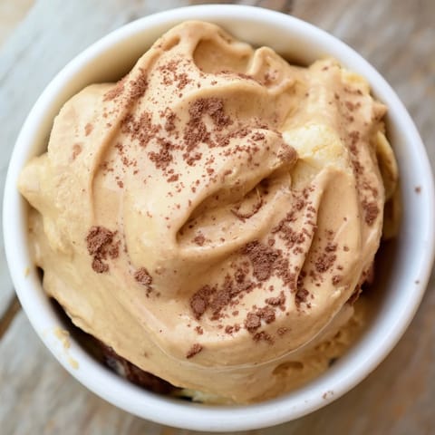 Creamy peanut butter banana ice cream swirled with rich peanut butter and ready to enjoy.