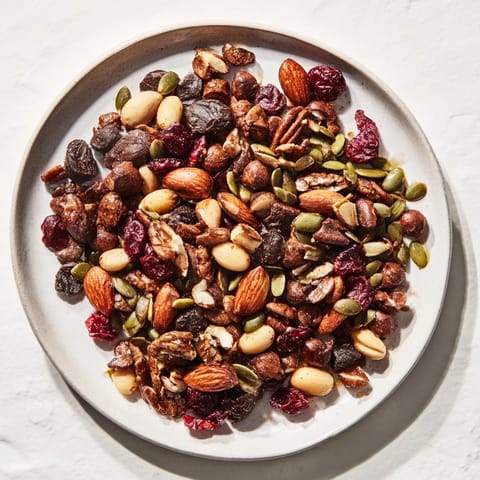 Savory Acorn & Oak Snack Mix, a mixture of seeds and nuts seasoned with warm spices.