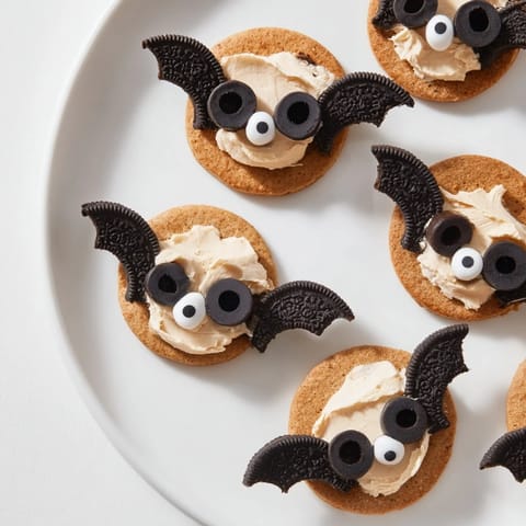 Close-up of a festive Flying Bat Halloween Snack Board overflowing with colorful, spooky treats.