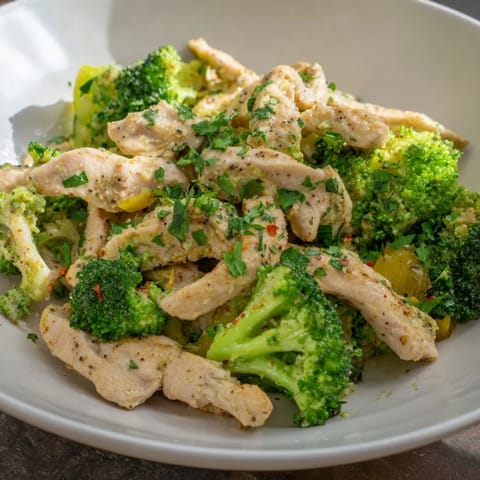 The vibrant green broccoli in this Microwave-Steamed Chicken and Broccoli dish looks perfectly crisp-tender and inviting.