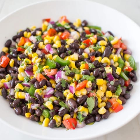 Close-up of a vibrant bowl of Cowboy Caviar Salad, ready to serve as a delicious dip.