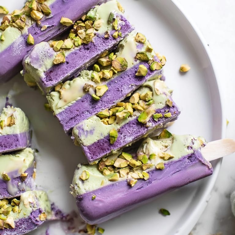 Delicious, layered ube and pistachio ice cream bars drizzled with condensed milk.