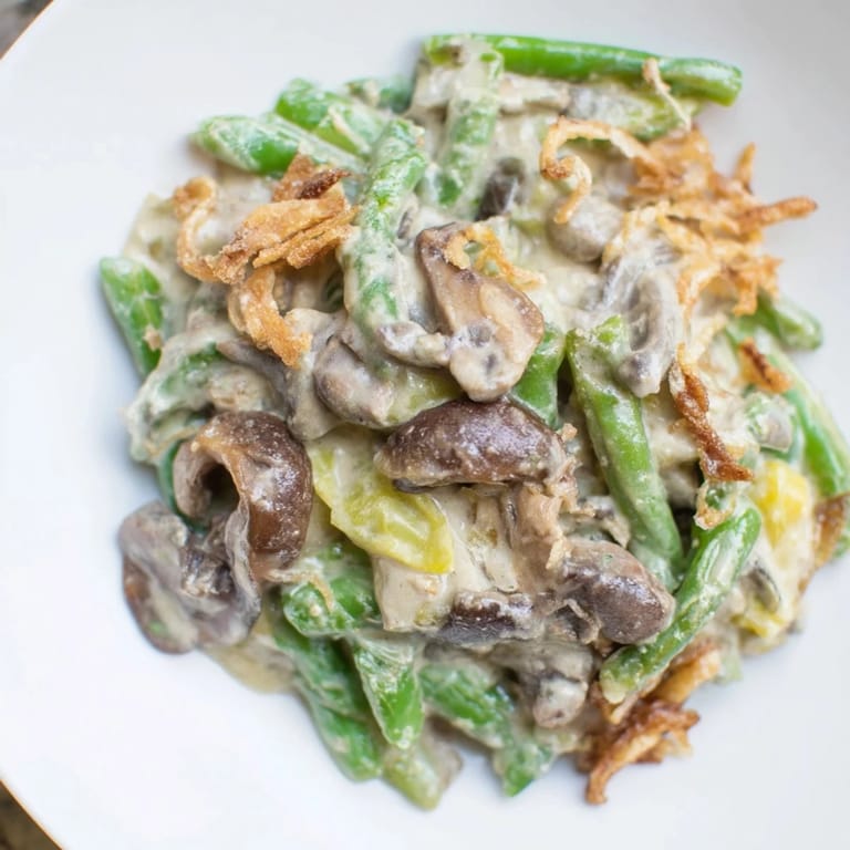 Tender green beans are coated in a rich sauce in this classic Old-School Green Bean Casserole recipe.