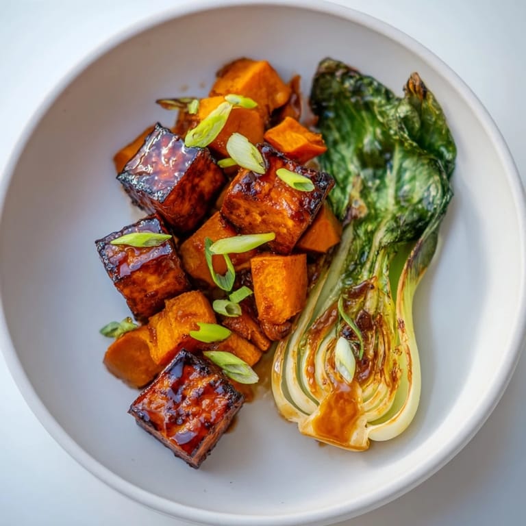 Roasted Miso-Glazed Tofu & Winter Squash offers a perfect balance of flavors and textures, with a glossy miso glaze.