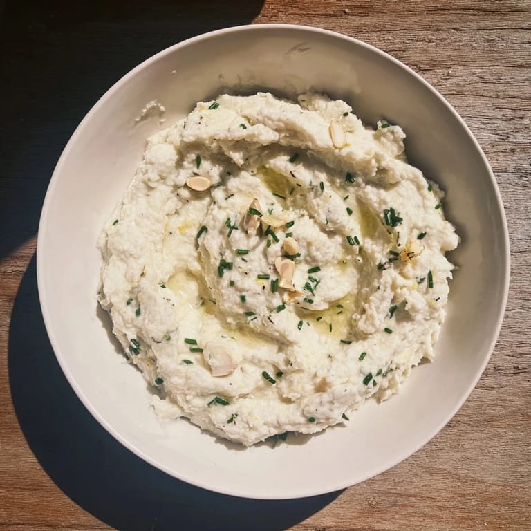 Picture a smooth, comforting bowl of cauliflower mash – a delicious, healthy side dish.