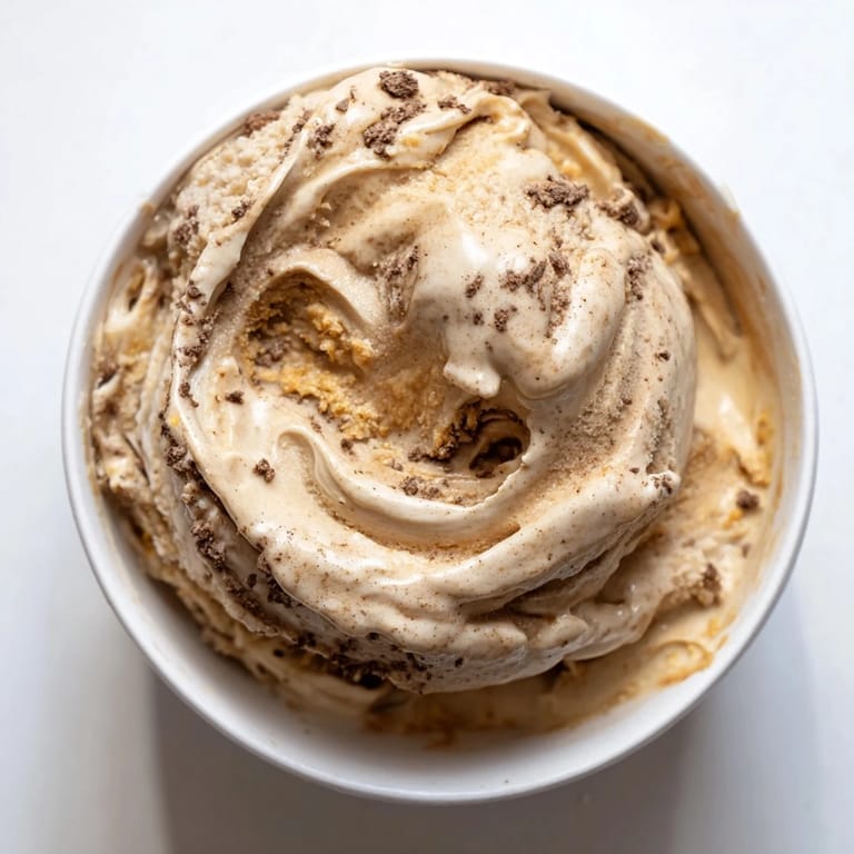Thick and decadent peanut butter banana ice cream in a bowl, perfect for a vegan dessert.