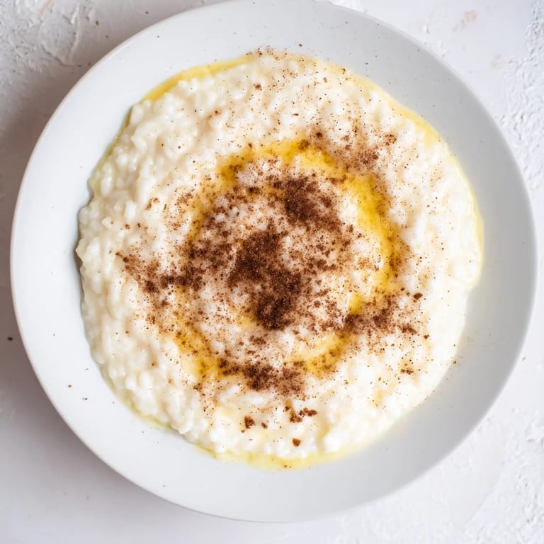 Warm, cinnamon-kissed rice pudding, a simple dessert to make from yesterday's leftover rice, ready to eat.