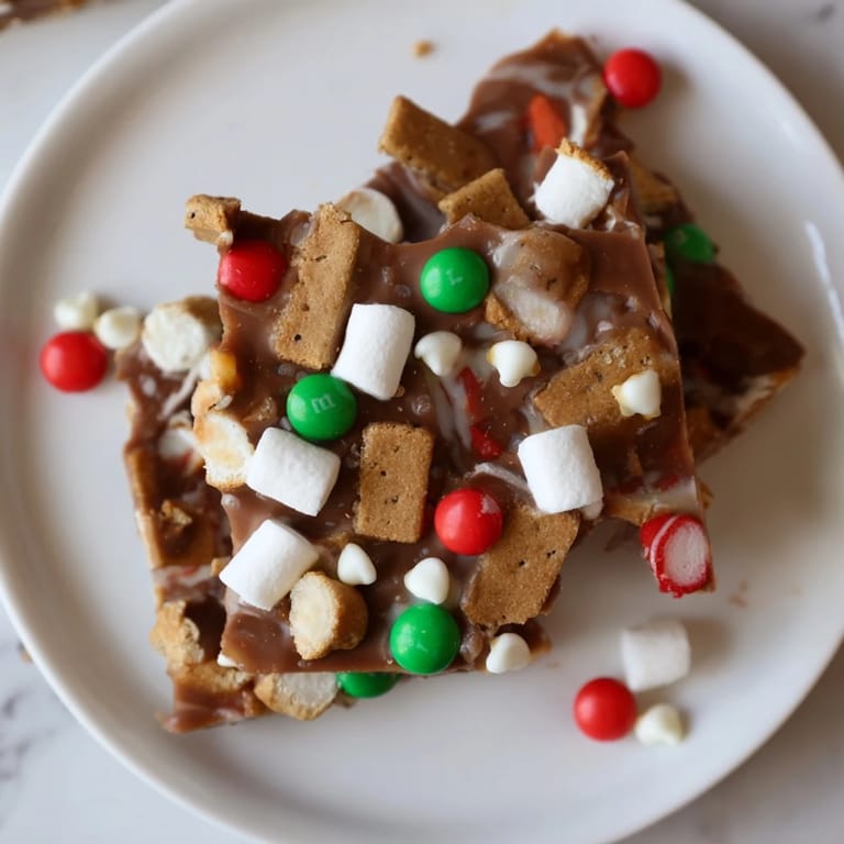 Enjoy the sweet allure of Quick Christmas Smores Bark—a delightful dessert bursting with holiday flavors and textures.