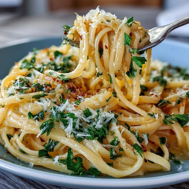 Bright, citrusy lemon butter pasta tossed with tender peas and topped with freshly grated Parmesan for a comforting meal.