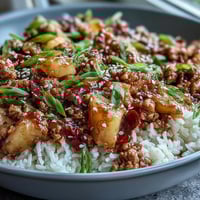 Sweet-and-Sour Turkey Rice Skillet filled with juicy pineapple chunks and colorful bell peppers, ready to serve.